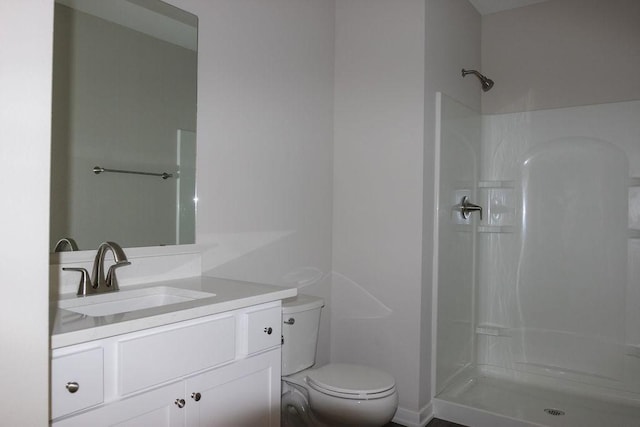 5515 167th St, Urbandale, IA 50323 - bathroom with toilet, vanity, and a shower