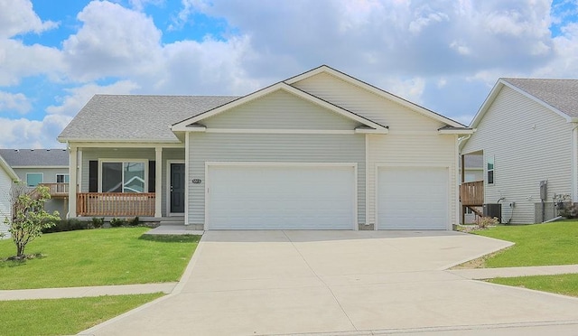 5515 167th St, Urbandale, IA 50323 - view of front facade featuring an attached garage, concrete driveway, a front yard, and a porch