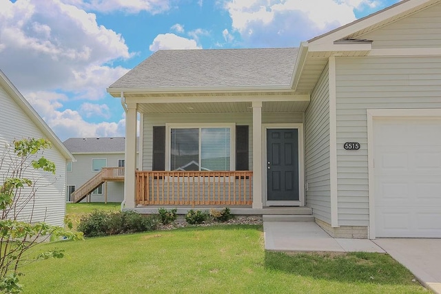 5515 167th St, Urbandale, IA 50323 - entrance to property featuring a porch, a lawn, and roof with shingles