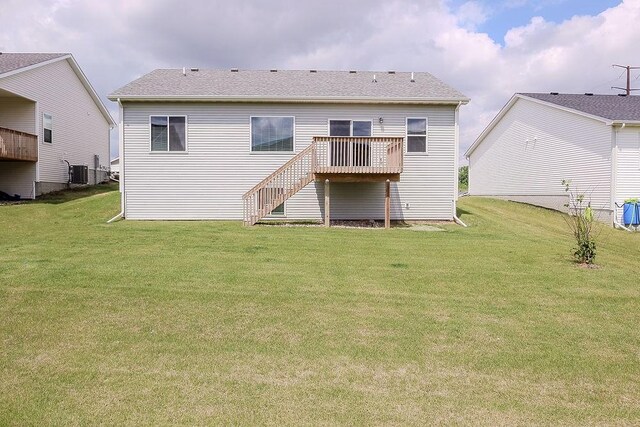 5515 167th St, Urbandale, IA 50323 - back of property with a wooden deck, stairway, a yard, and central air condition unit