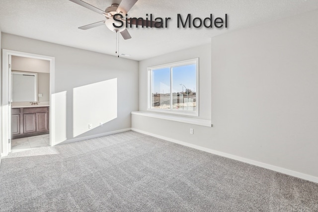 429 Napoli Ave, West Des Moines, IA 50266 - carpeted empty room featuring baseboards and a ceiling fan