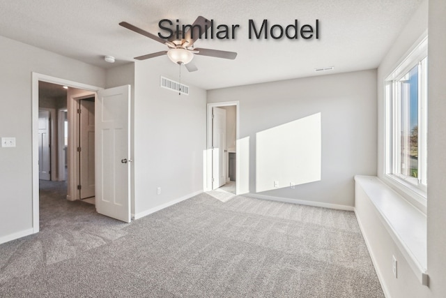 429 Napoli Ave, West Des Moines, IA 50266 - unfurnished bedroom with carpet, baseboards, and a ceiling fan