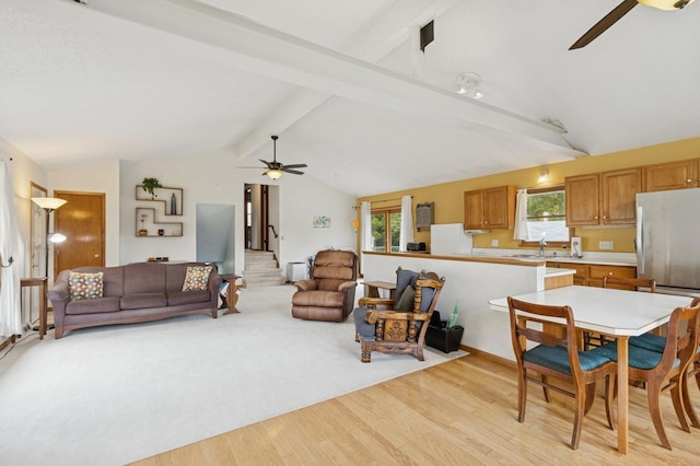 1801 Payton Ave, Des Moines, IA 50315 - living room with ceiling fan, light wood-type flooring, and stairs