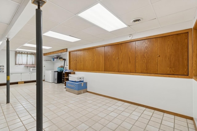 1801 Payton Ave, Des Moines, IA 50315 - finished basement with a paneled ceiling, washer / dryer, and baseboards