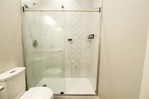 2430 SE Willowbrook Dr, Waukee, IA 50263 - bathroom with toilet and a stall shower