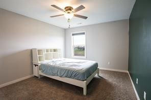 2430 SE Willowbrook Dr, Waukee, IA 50263 - carpeted bedroom featuring baseboards and a ceiling fan