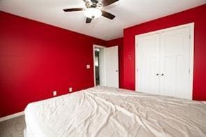 2430 SE Willowbrook Dr, Waukee, IA 50263 - unfurnished bedroom with carpet, a closet, baseboards, and a ceiling fan