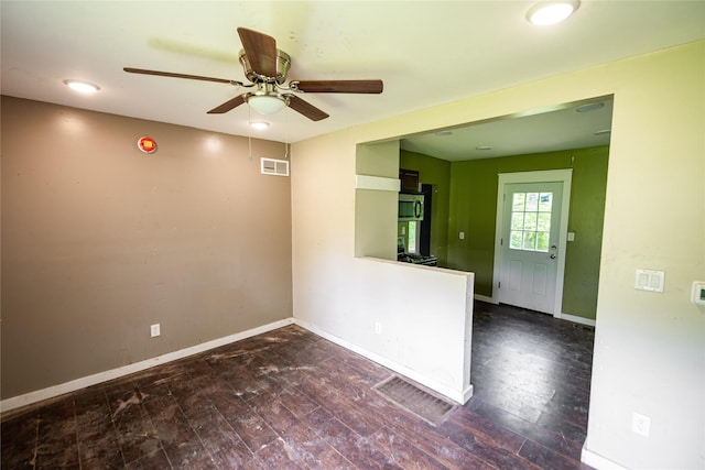 3518 Easton Blvd, Des Moines, IA 50317 - empty room with a ceiling fan, baseboards, and wood finished floors