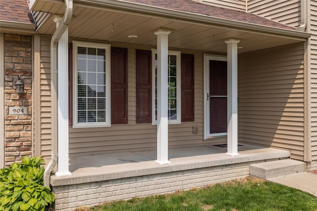 904 SE Little Beaver Dr, Grimes, IA 50111 - entrance to property with a porch and a shingled roof