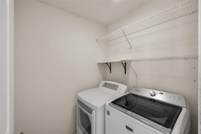 904 SE Little Beaver Dr, Grimes, IA 50111 - laundry area with washer and clothes dryer