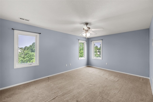 904 SE Little Beaver Dr, Grimes, IA 50111 - carpeted empty room featuring a ceiling fan and baseboards
