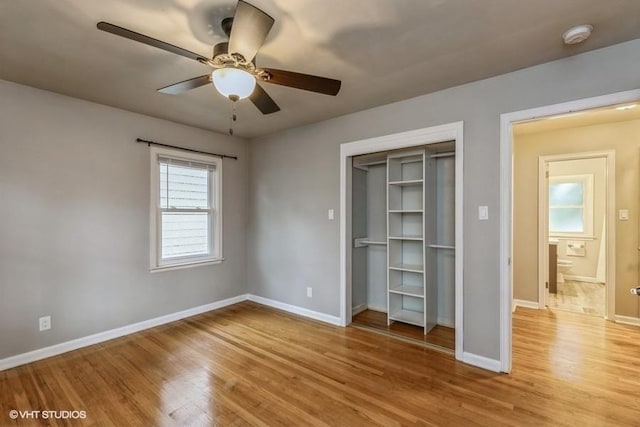 6445 Center St, Windsor Heights, IA 50324 - unfurnished bedroom with light wood finished floors, baseboards, and a closet