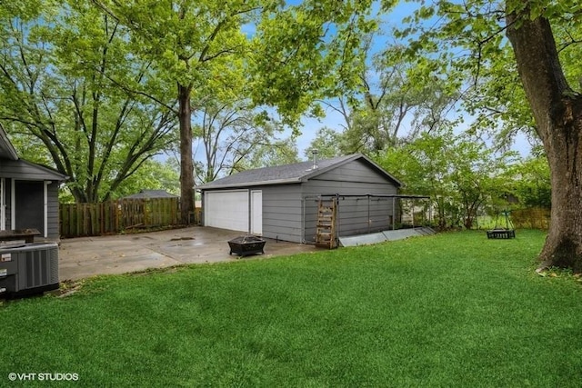 6445 Center St, Windsor Heights, IA 50324 - detached garage featuring central air condition unit
