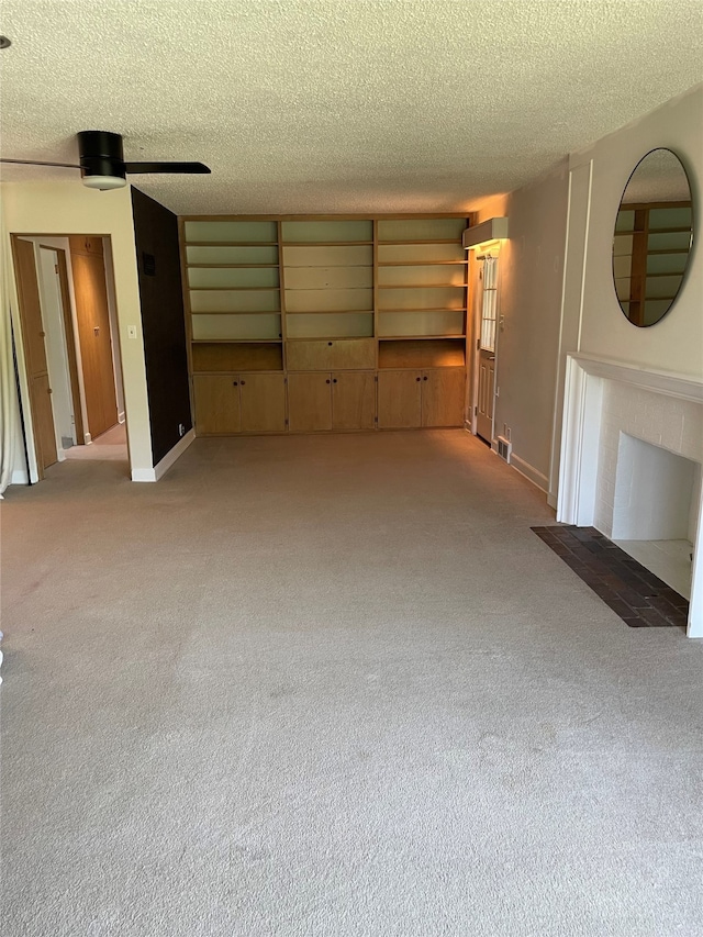 1620 Broad St, Grinnell, IA 50112 - unfurnished living room with light carpet, a textured ceiling, and baseboards