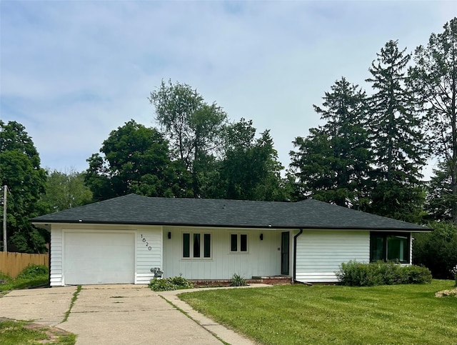 1620 Broad St, Grinnell, IA 50112 - ranch-style home featuring driveway, an attached garage, and a shingled roof