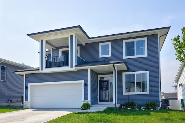 2930 Kestrel St, Norwalk, IA 50211 - view of front of property featuring a garage, a balcony, driveway, and a front yard