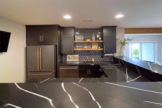 1000 NE 23rd St, Grimes, IA 50111 - kitchen featuring stainless steel appliances, dark countertops, decorative backsplash, recessed lighting, and a sink
