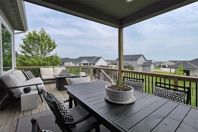1000 NE 23rd St, Grimes, IA 50111 - wooden deck featuring outdoor dining space, a residential view, and an outdoor living space
