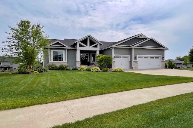 1000 NE 23rd St, Grimes, IA 50111 - craftsman inspired home featuring an attached garage, concrete driveway, a front yard, and stone siding