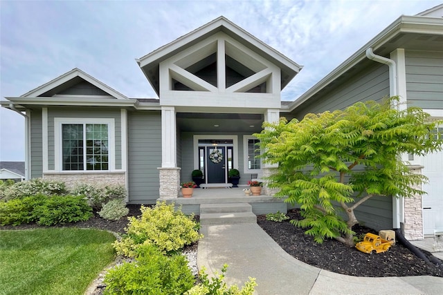 1000 NE 23rd St, Grimes, IA 50111 - property entrance featuring stone siding and covered porch