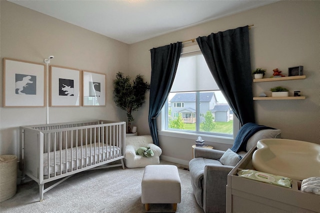 1000 NE 23rd St, Grimes, IA 50111 - bedroom featuring carpet, a nursery area, and baseboards