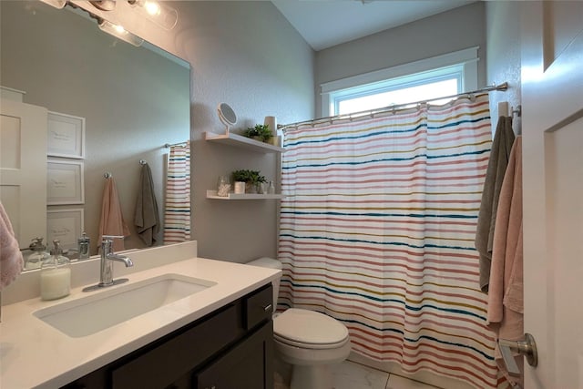 1000 NE 23rd St, Grimes, IA 50111 - bathroom with toilet, vanity, marble look tiles, and a shower with curtain