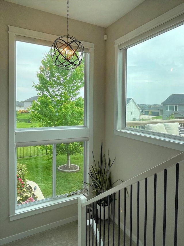 1000 NE 23rd St, Grimes, IA 50111 - detailed view of a chandelier and baseboards