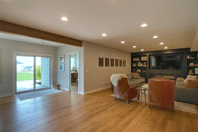 1000 NE 23rd St, Grimes, IA 50111 - living room with recessed lighting, baseboards, light wood-type flooring, beamed ceiling, and built in shelves