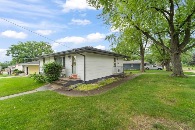 530 Stuart St, Carlisle, IA 50047 - view of side of property featuring a lawn