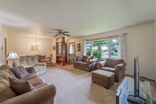 530 Stuart St, Carlisle, IA 50047 - living room with a chandelier, light carpet, and ceiling fan