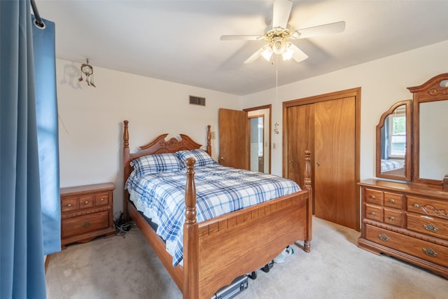 530 Stuart St, Carlisle, IA 50047 - bedroom with light colored carpet, ceiling fan, and a closet