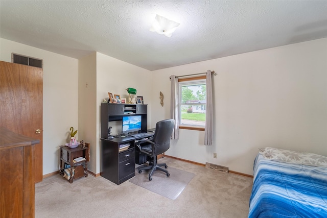 530 Stuart St, Carlisle, IA 50047 - bedroom with light colored carpet, an office area, baseboards, and a textured ceiling
