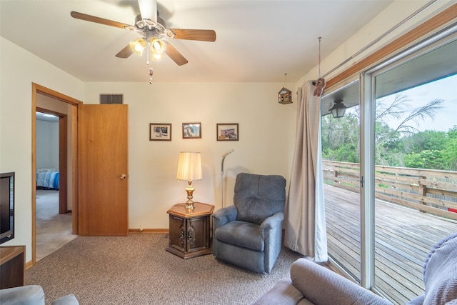 530 Stuart St, Carlisle, IA 50047 - sitting room with ceiling fan, carpet, and baseboards