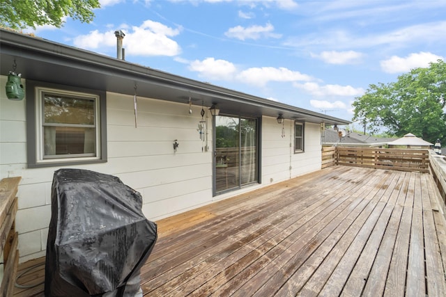 530 Stuart St, Carlisle, IA 50047 - wooden deck with a grill