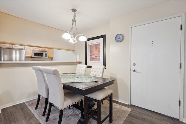 6440 Ep True Pkwy Unit 3102, West Des Moines, IA 50266 - dining area featuring dark wood-type flooring and baseboards