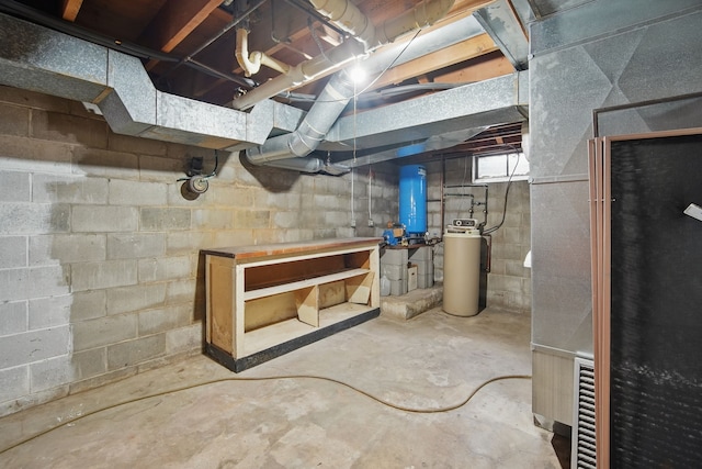 4500 100th St, Urbandale, IA 50322 - basement with a water softener system, a water pressure tank, and heating unit