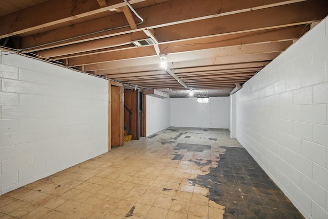 4500 100th St, Urbandale, IA 50322 - unfinished basement featuring stairs and concrete block wall