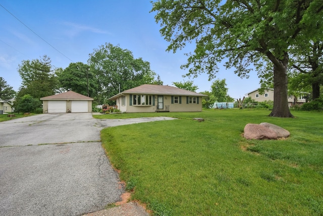 4500 100th St, Urbandale, IA 50322 - view of front of house featuring a garage, a front yard, and an outdoor structure