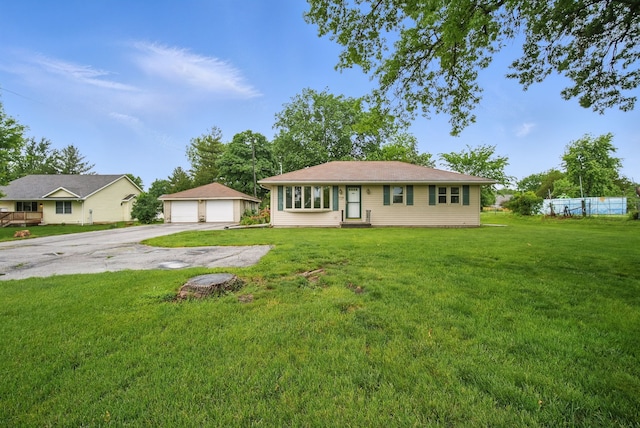 4500 100th St, Urbandale, IA 50322 - single story home with a detached garage, an outdoor structure, and a front lawn
