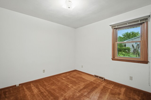 4500 100th St, Urbandale, IA 50322 - carpeted empty room with baseboards