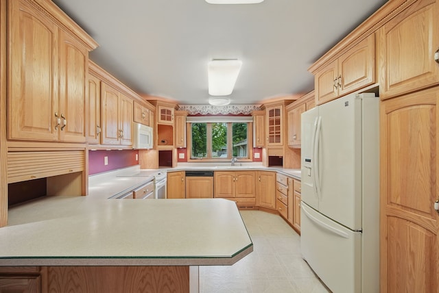 4500 100th St, Urbandale, IA 50322 - kitchen featuring white appliances, light brown cabinetry, a peninsula, light countertops, and glass insert cabinets