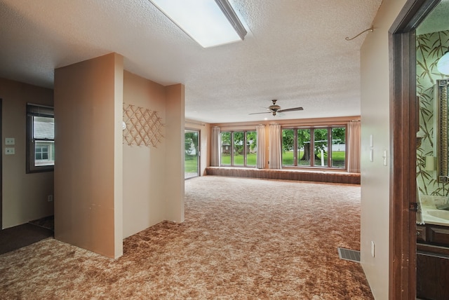 4500 100th St, Urbandale, IA 50322 - corridor featuring carpet floors and a textured ceiling