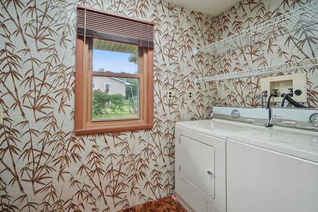 4500 100th St, Urbandale, IA 50322 - laundry area with wallpapered walls and independent washer and dryer