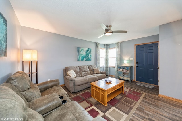 312 NE Harvey St, Grimes, IA 50111 - living area featuring baseboards, wood finished floors, and a ceiling fan
