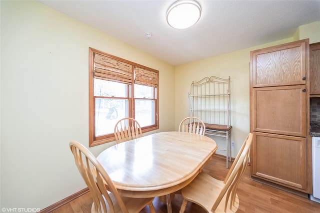 312 NE Harvey St, Grimes, IA 50111 - dining space featuring light wood-style floors and baseboards