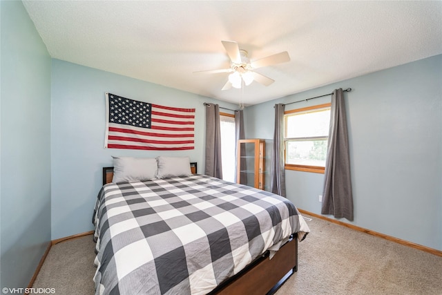 312 NE Harvey St, Grimes, IA 50111 - bedroom featuring carpet, baseboards, and ceiling fan