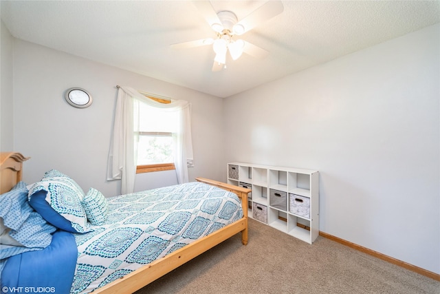 312 NE Harvey St, Grimes, IA 50111 - bedroom with carpet, ceiling fan, and baseboards