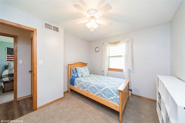312 NE Harvey St, Grimes, IA 50111 - bedroom with baseboards, carpet floors, and a ceiling fan