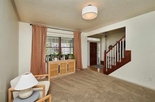 2556 NW 162nd St, Clive, IA 50325 - carpeted entryway featuring a textured ceiling, stairs, and crown molding