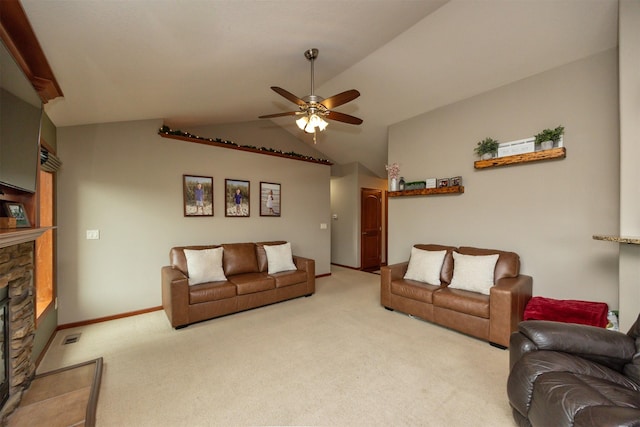1324 Joshua Cir SE, Bondurant, IA 50035 - living area with a ceiling fan, light carpet, a stone fireplace, lofted ceiling, and baseboards